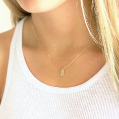 "Dainty Initial Charm Necklace . Dainty and meaningful, wear your favorite initials close to your heart. Choose 14kt gold filled or sterling silver options. These mini rectangle charms grace a drawn cable chain for a classic and minimal look. D E T A I L S -Rectangle Disc measures 10mm -Choose 14kt Gold-Filled or Sterling Silver - not plated. -A high quality drawn cable chain with a spring clasp. -Polished to a light satin finish. CUSTOM HAND STAMPING -Hand stamped with an initial or heart symbo Everyday Hypoallergenic 14k Gold Charm Necklace, Dainty Charm Necklaces With Rectangular Pendant, Dainty 14k Gold Rectangular Pendant Charm Necklaces, Minimalist 14k Gold Filled Charm Necklace For Anniversary, Dainty 14k Gold Filled Initial Necklace For Everyday, Everyday Hypoallergenic 14k Gold-filled Charm Necklaces, Gold Dainty Initial Necklace For Mom, Dainty Gold Initial Necklace As Gift For Mom, Dainty 14k Gold Filled Initial Necklace Gift