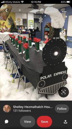 the polar express train table is set up for christmas