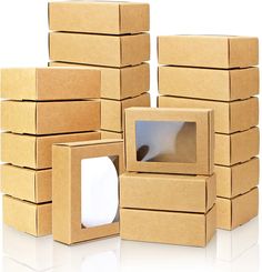 several cardboard boxes stacked on top of each other with a small window in the middle