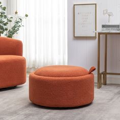 an orange chair and ottoman in a living room