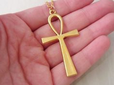 Huge antique gold toned Egyptian ankh charm necklace. This necklace includes:- ankh charm (size 55 mm | 2 1/8 inch)- gold anchor chain (14 to 36 inches)To Add Initials: http://etsy.me/1GtpsWWTo Add Birthstones: http://etsy.me/1PFtE6K♥ SHIPPING INFO ♥We ship Tuesdays and Fridays.To USA:- Provider: Chit Chats Express (who deals directly with USPS)- Arrival Time: 5-10 days (1-3 days for preparation, 5-7 for shipping time)- Tracking: Yes- Ships out from Vancouver, CanadaTo Canada:- Provider: Canada Antique Gold Ankh Jewelry, Ankh Pendant, Egyptian Ankh, Ankh Necklace, Time Tracking, Anchor Chain, 10 Days, Antique Gold, Charm Necklace