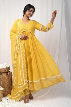 Yellow three fourth sleeves Aliya cut gathered anarkali with floral lace detailing on the yoke,hem and bloom embroidery on the sheer sleeves. Paired with a floral embroidered sheer hem pant and lace embellished scallop hem dupatta. - Aza Fashions Festive Maxi Length Dress With Lace Work, Spring Anarkali Kurta With Sheer Dupatta, Bollywood Style Lace Dress With Dupatta, Spring Designer Anarkali Set With Cutdana, Anarkali Lace Dresses With Dupatta, Festive Anarkali Dress With Lace Work, Floor-length Lace Work Dress For Diwali, Festive Lace Work Maxi Dress, Floor-length Lace Dress For Diwali