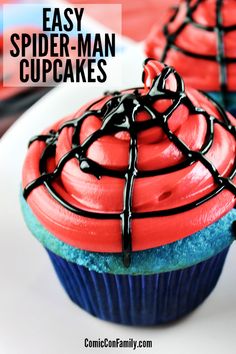 two spider - man cupcakes on a white plate with the words easy spider - man cupcakes