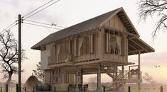 a wooden house sitting on top of a lush green field