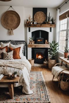 a bedroom with a fireplace and lots of pillows