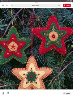 three ornaments hanging from a christmas tree on the app store's facebook page, which is displaying an image of two red and green stars