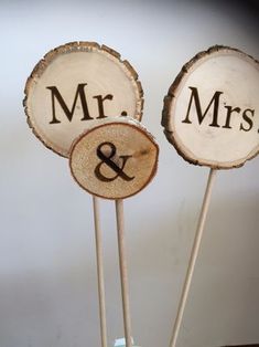 two wooden signs that say mr and mrs on them