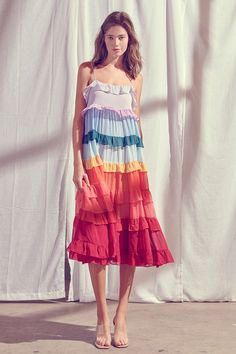 This Rainbow Maxi Dress is an absolute showstopper! Flaunting rainbow colored ruffled tiered tiers and an adorable keyhole back with a bow accent, it's the perfect way to make a style statement. With adjustable straps for the ideal fit, you'll look eye-catching and feel endlessly confident in this stunning dress.  Mate Cotton Dress Ideas, Cruise Fits, Im Not Pretty, Color Block Maxi Dress, Last Unicorn, Ruffle Midi Dress, Low Neckline, Rainbow Dress, Dress Aesthetic