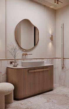 a bathroom with a round mirror above the sink and a stool in front of it