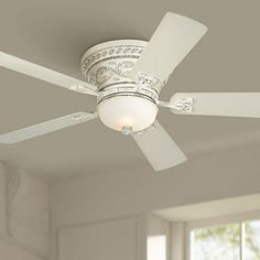 a white ceiling fan in a living room