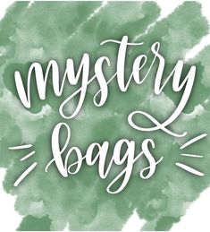 the words mystery bags written in white ink on a green watercolor stained background