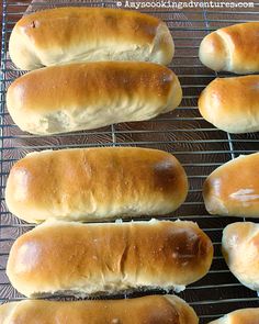 six hotdogs cooling on a wire rack