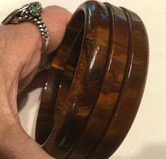 This is a vintage 1940s-1950s, original & complete, matched, 3 piece, "Bookend" set of brown, marbled, bakelite bangles.  They have been Simichrome tested with positive, bakelite results.  Are they "Mississippi Mud" you ask?  I do not know, am not an authority.  These chocolate, brown, bangles have a mottled pattern consisting of various shades of brown & golden butterscotch.  They are narrow, original, matching set of bangles each one slightly different in size with a diameter of 2.5 inches.  T Brown Bangles, Mississippi Mud, Bakelite Bangles, Brown Jewelry, Vintage Bangles, Bangle Bracelet Set, Crystal Bangle, Jewelry Fashion Trends, Shades Of Brown