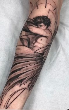 a man's arm with an artistic tattoo design on the side of his leg