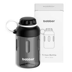 a black and white water bottle next to a box with the word bobber on it