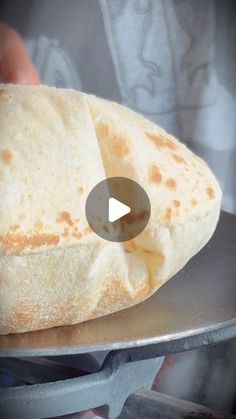 a flat bread sitting on top of a metal pan