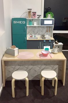 two stools sitting at a table in a room