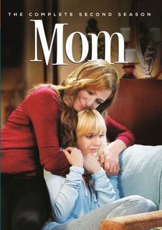 the movie mom features two women sitting on a couch, one with her arm around the other's head