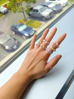 Cute beaded flower rings that will brighten up all your outfits and add a touch color to all styles! Made with Japanese Toho Beads, size 2mm and stretchy string so it'll be adjustable. Sizing is according to the ring finger.  *Please note that to preserve the rings for a long time, please keep it away from water and sunlight for the colors will fade away with time.* Beaded Flower Rings, Flower Rings, Toho Beads, Strawberry Milk, Flower Bracelet, Color Ring, Ring Finger, Flower Ring, Free Items