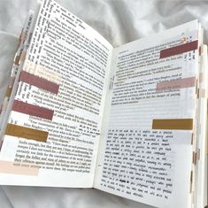 an open book with some type of text on the page and two different colored strips