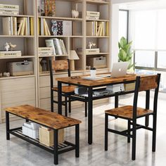 a computer desk with two benches in front of it