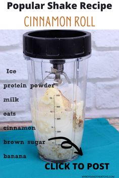 a blender with ingredients for cinnamon roll protein shake in it on a blue mat