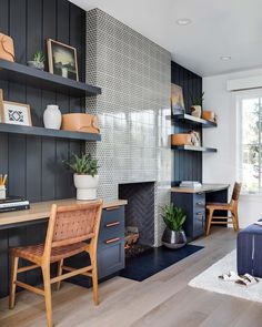 a living room filled with furniture and a fire place next to a wall mounted tv