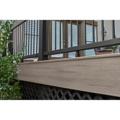 a close up of a wooden balcony railing