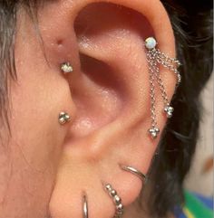 a person with some piercings on their ear