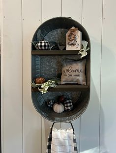 a round shelf with some decorative items on it and a sign that says, welcome