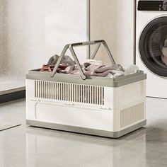 a laundry basket with clothes in front of a washing machine and dryer on the floor