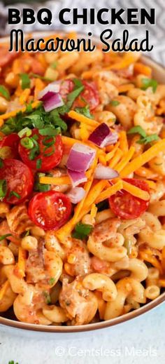 this bbq chicken macaroni salad is loaded with shredded cheese, tomatoes, onions, and parmesan cheese