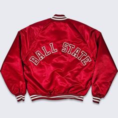 Ball State Cardinals Vintage 80s Chalk Line Satin Bomber Jacket  Ball U University Red Varsity Coat  Extremely Rare  Snap Closure In Excellent Vintage Condition No Holes or Stains Size Men's Large PLEASE CHECK YOUR MEASUREMENTS Measurements: Length: 26 in Pit to pit: 25 in FREE AND FAST SHIPPING IN THE USA Collegiate Red Varsity Jacket With Long Sleeves, Collegiate Red Long Sleeve Varsity Jacket, Vintage Red Long Sleeve Track Jacket, Vintage Red Varsity Jacket With Long Sleeves, Retro Red College Outerwear, Retro Red Outerwear For College, Red Track Jacket For College In Fall, Red Long Sleeve Varsity Jacket For Spring, Red Varsity Track Jacket For Fall