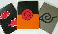 three notebooks with different designs on them