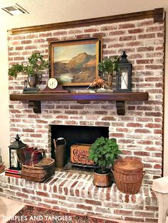 a brick fireplace with potted plants and other items on the mantel above it