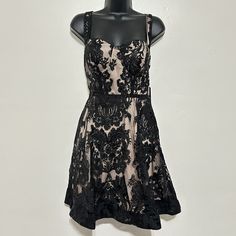 Size Large Bust 17" Pit To Pit Laid Flat Waist 14.5" Length 35" From Shoulder To Hem Retail For $78 The Lulus Love Eternal Black Sequin Embroidered Bustier Skater Dress Is Always The Hit Of The Party! Sheer Black Mesh Features An Elegant Embroidered Design With Matching Sequins, Over A Knit Lining As It Shapes Tank Straps And A Bustier Bodice With Padded Cups. Fitted Waist Above A Full Skater Skirt With Structured Hem For Added Flair. Hidden Back Zipper/Clasp. Beautiful Dress For Any Fancy Occas Black Lace Mini Dress With Fitted Bodice, Black A-line Mini Dress With Fitted Bodice, Black A-line Dress With Corset Back, Black Lace Mini Dress With Sweetheart Neckline, Black Lace Mini Dress For Prom, Black Lace Dress With Corset Back, Black Corset Back Dress For Date Night, Black Dress With Corset Back For Date Night, Black Fit And Flare Lined Mini Dress