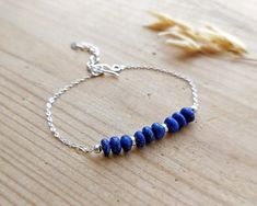 925 Lapis Lazuli Sterling Silver Bracelet, Dainty Birthstone Bracelet, September Birthstone, Silver Gemstone Bracelet DESCRIPTION Delicate 925 sterling silver birthstone bracelet featuring Lapis Lazuli gemstone beads. Lapis Lazuli is a birthstone for September. The bracelet would  make a perfect birthday gift for a loved one, close friend or family.  The bracelet comes in a lovely fabric pouch as standard. If you would prefer for your jewellery to be presented in a pretty gift box instead, pleas Silver Bracelets With Lapis Lazuli Natural Stones, Blue Dainty Birthstone Bracelets, Lapis Lazuli Beaded Bracelet Gift, Silver Lapis Lazuli Hand-strung Bracelets, Silver Lapis Lazuli Bracelet, Hand-strung, Lapis Jewelry, Lapis Lazuli Bracelet, Fabric Pouch, Bracelet Dainty