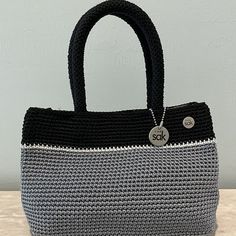 Beautiful 3 Color Crochet Satchel By The Sak. Black Cloth Interior With Double Snap Closure. Inside Zip Pocket Like New Condition Without Tags Approximate Size: 10"W X 7"H X 4"D 5" Handle Drop Perfect Size To Hold All Your Necessities & Then Some! 3 Color Crochet, Crochet Satchel, The Sak, Large Tote, 7 H, Crochet Bag, Black Grey, Piping, Snap Closure