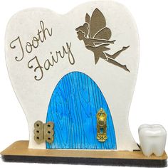 tooth fairy toothbrush holder with toothpaste next to it