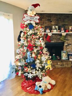 a christmas tree decorated with teddy bears and other holiday decorations