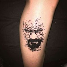 a man's arm with a black ink drawing of a face and glasses on it