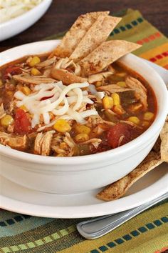 a white bowl filled with chicken tortilla soup