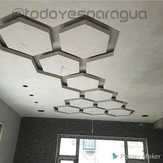 the ceiling is made up of hexagonal tiles