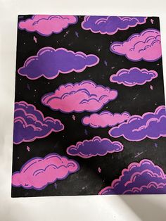 an image of pink and purple clouds on black paper