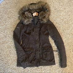 Trim Fitted Abercrombie Parka Style Coat Faux Fur Lined Fur Around Hood Is Removable Very Well Loved, Looks Almost Brand New, No Stains Rips Or Sign Of Wear. This Is Not Abercrombie And Fitch So Of Course Sizes Run Smaller! This Is A Size X-Large Juniors But Would Fit Size X-Small Adult. Open To Any Offers Faux Fur Parka For Cold Weather In Fall, Cold Weather Parka With Faux Fur Lining, Winter Outerwear With Faux Fur Lining For Cold Weather, Winter Wear Outerwear With Faux Fur Lining, Winter Faux Fur Outerwear With Pockets, Fall Outerwear With Faux Fur Trim For Cold Weather, Fall Parka With Faux Fur Trim, Fall Parka With Faux Fur Trim And Long Sleeves, Faux Fur Outerwear With Pockets For Fall