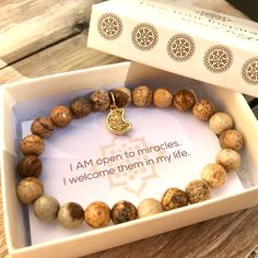 “Stress is an ignorant state. It believes that everything is an emergency. Nothing is that important.” #truth - Natalie Goldberg⁠ ⁠ Featured: Alleviate Stress, Fear and Anxiety Bracelet - Available at JeanneVergerJewelry.com Fertility Crystals, Prosperity Bracelet, Gemstone Jewellery Design, Creative Visualization, Lotus Jewelry, Lotus Necklace, Wrist Mala, Meditation Bracelet, Brown Kraft Paper