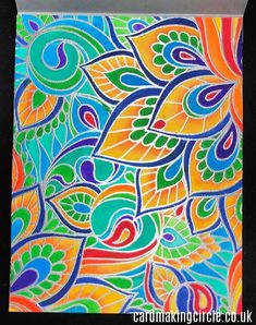 a colorful painting with lots of different colors and patterns on the paper, it is easy to draw