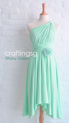 a green dress on a mannequin dummy