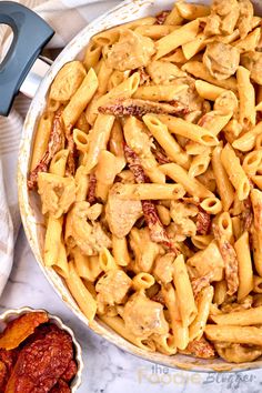 a large pot filled with pasta and sauce