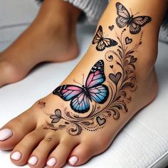 a woman's foot with butterfly tattoos on it